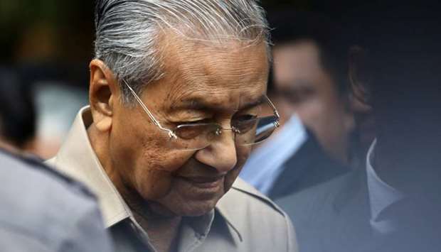 Malaysia's Interim Prime Minister Mahathir Mohamad leaves after an event in Kuala Lumpur, Malaysia
