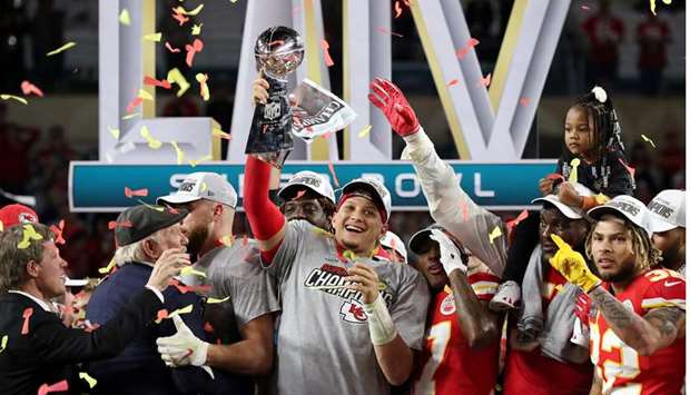 Kansas City Chiefs quarterback Patrick Mahomes (centre) celebrates with the Vince Lombardi Trophy after defeating the San Francisco 49ers in Super Bowl LIV at Hard Rock Stadium. PICTURE: USA TODAY Sports