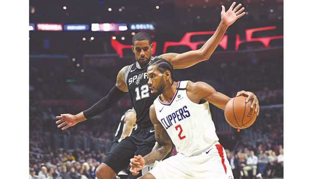 Los Angeles Clippers forward Kawhi Leonard (right) drives to the basket against San Antonio Spurs forward LaMarcus Aldridge in the first half at Staples Center. PICTURE: USA TODAY Sports