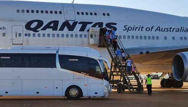 Australian evacuees from Wuhan, China arrive at RAAF base Learmonth in Western Australia on board a chartered Qantas Boeing 747-400 plane prior to their quarantine at Christmas Island yesterday. Australia Department Of Defence/Handout via REUTERS