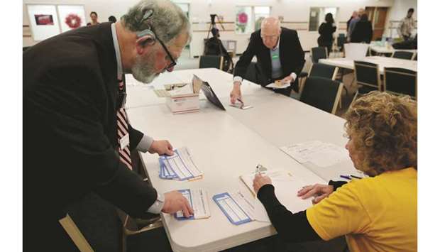 Iowa caucus precinct workers count and tally Democratic caucus votes by hand at West Des Moines Christian Church on Monday night.