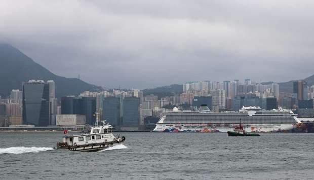 A Department of Health ship heads to the Kai Tak Cruise Terminal, where the World Dream ship that had been denied entry in Taiwan's Kaohsiung amid concerns of coronavirus infection on board is docked, in Hong Kong