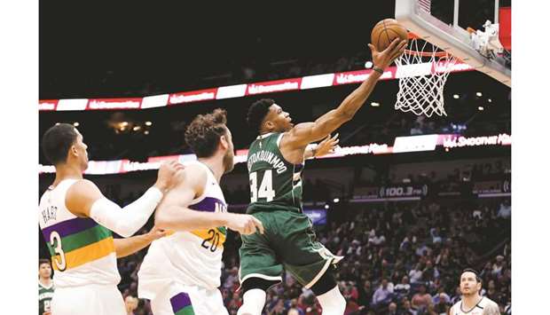 Milwaukee Bucks forward Giannis Antetokounmpo (right) scores past New Orleans Pelicans forward Nicolo Melli (second left) and guard Josh Hart during the second half at the Smoothie King Center. PICTURE: USA TODAY Sports