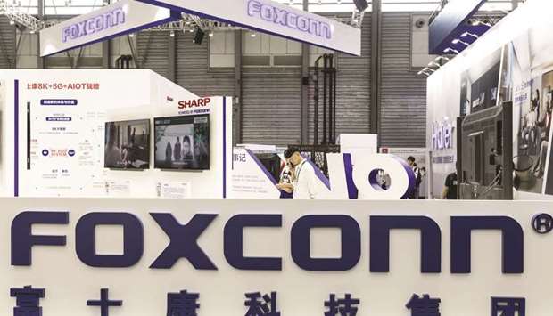 Signage for Foxconn Technology Group is displayed at the companyu2019s booth at the CES Asia 2018 show in Shanghai (file).