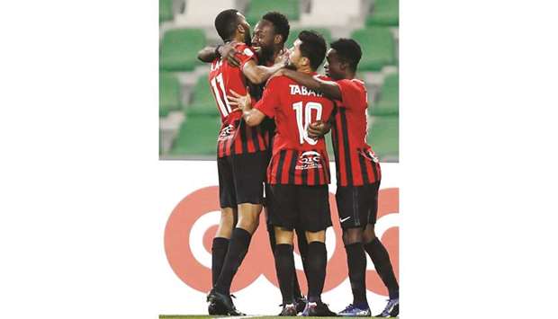 Al Rayyanu2019s Yohan Boli (second from left) is congratulated by his teammates after his first goal against Mesaimeer yesterday.