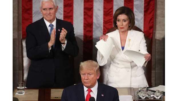 House Speaker Rep. Nancy Pelosi (D-CA) rips up pages of the State of the Union speech after US President Donald Trump finishes his State of the Union speech in the chamber of the US House of Representatives