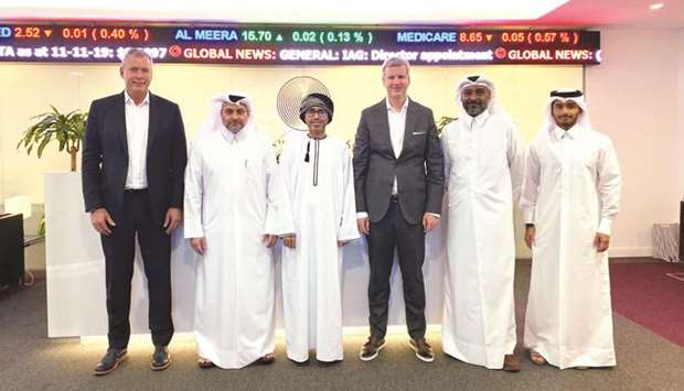QFCA chief executive Yousuf Mohamed al-Jaida (2nd from left), Hamour (2nd from right), Sandmeier (third from right) with members of the QFC and Instimatch management.