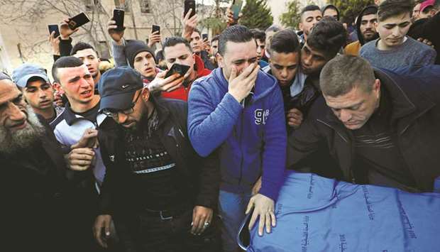 Relatives of 17-year-old Palestinian Mohamed al-Haddad react at a hospital in Hebron in the occupied West Bank, yesterday.