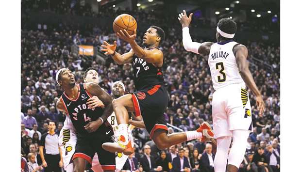 Toronto Raptors guard Kyle Lowry (centre) goes up to make a basket against the Indiana Pacers during the second half at Scotiabank Arena. PICTURE: USA TODAY Sports