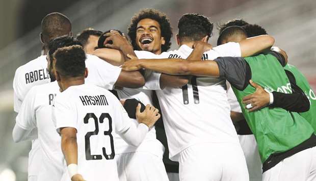 Akram Afif is all smiles as he celebrates with teammates after Al Saddu2019s victory over Al Kharaitiyat. At right, Al Duhailu2019s North Korean striker Han Kwang Song (R) is congratulated by Sultan al-Brake after scoring against Muaither. PICTURES:  Noushad and Anas