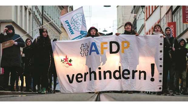 People protest against the far-right AfD party in Erfurt. The main banner reads u2018Preventu2019.