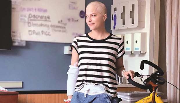 Actress Selma Blair, who has battled multiple sclerosis (MS), poses with an Alinker u2018walking bikeu2019, a mobility device for people with disabilities, in an unknown location in this undated handout photo.