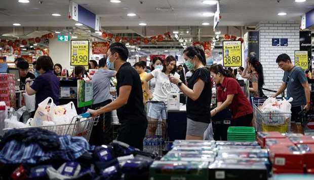 People stock up on food supplies after Singapore raised coronavirus outbreak alert to orange, at a supermarket in Singapore