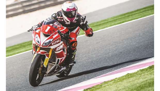 Saeed al-Sulaiti celebrates after taking the pole position for todayu2019s penultimate round of the Qatar Superstock 600 at the Losail International Circuit.