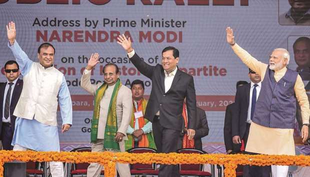 Prime Minister Narendra Modi along with Assam Chief Minister Sarbananda Sonowal (second right), Assam governor Jagdish Mukhi (second left) and Assam Finance Minister Himanta Biswa Sarma wave to the public during a public rally on the occasion of the celebration of the tripartite Bodo Peace Accord at Khargaon-Tengapara area in Kokrajhar, Assam, yesterday.