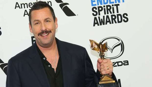 Winner of Best Male Lead for ,Uncut Gems, US actor Adam Sandler poses in the press room during the 35th Film Independent Spirit Awards in Santa Monica