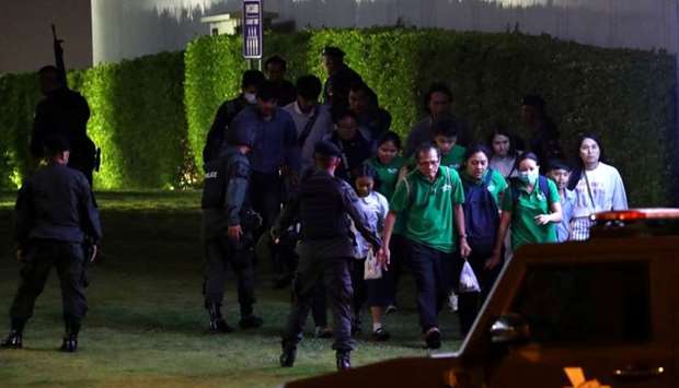 Thailand security forces evacuated people from a shopping mall as they chase a shooter hidden inside after a mass shooting in front of the Terminal 21, in Nakhon Ratchasima, Thailand