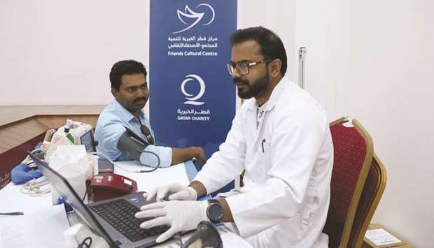 A visitor being examined at a medical camp.