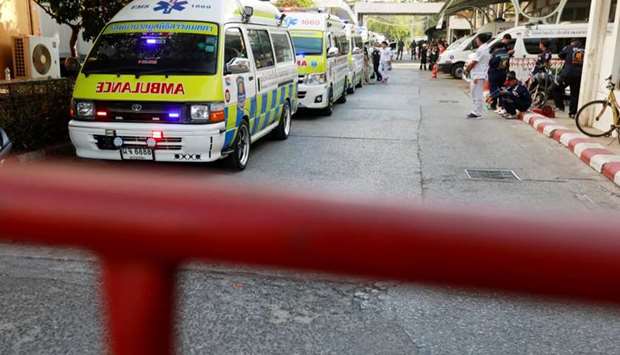 Ambulances carrying the bodies of the victims arrive at a hospital in Nakhon Ratchasima, Thailand