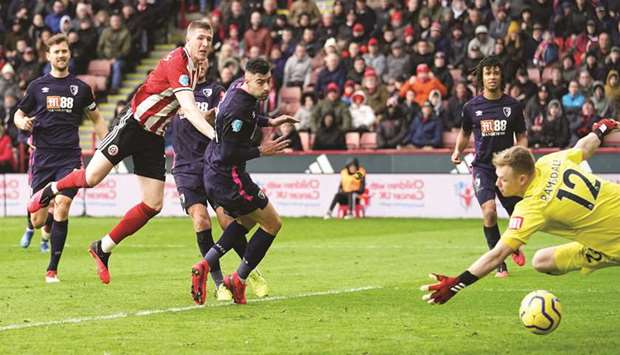 Sheffield Unitedu2019s John Lundstram (second from left) scores their second goal during the English Premier League match against Bournemouth in Sheffield, United Kingdom, yesterday. (Reuters)
