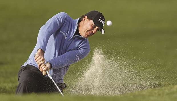 Phil Mickelson of the United States plays a shot from a bunker on the second hole during the third round of the AT&T Pebble Beach Pro-Am at Pebble Beach on Saturday. (AFP)