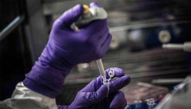 A scientist is at work in the VirPath university laboratory, classified as ,P3, level of safety as they try to find an effective treatment against the new SARS-like coronavirus