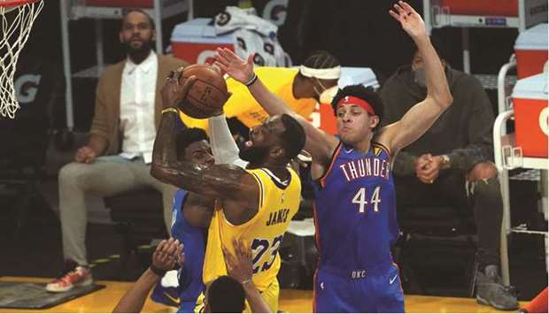Los Angeles Lakers forward LeBron James is defended by Oklahoma City Thunder forwards Darius Bazley and Justin Jackson (right) during their the NBA game in Los Angeles. (USA TODAY Sports)
