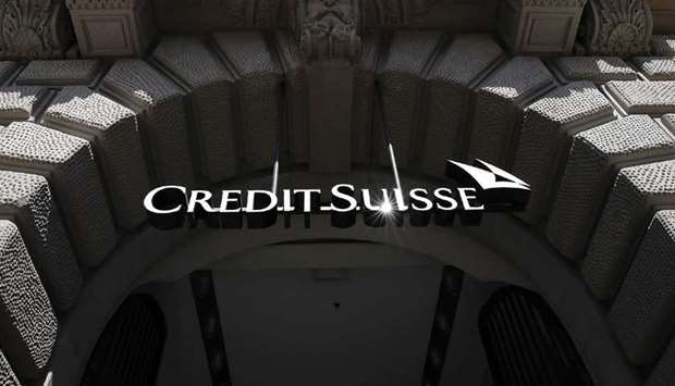 A logo hangs above the entrance to the Credit Suisse Group headquarters in Zurich. Hedge funds VR Capital Group and Farallon Capital Partners have filed lawsuits against both Credit Suisse Group and the government of Mozambique over a $2bn debt scandal.