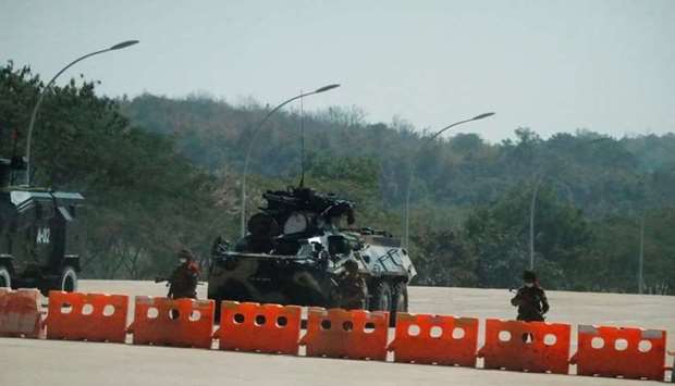 Soldiers stand guard at a Myanmar's military checkpoint on the way to the congress compound in Naypyitaw, Myanmar. REUTERS