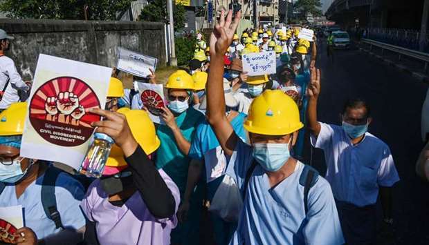 Medical personnel take part in a demonstration against the military coup in Yangon