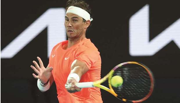 Spainu2019s Rafael Nadal hits a return against Michael Mmoh of the US during their match on day four of the Australian Open in Melbourne  yesterday.
