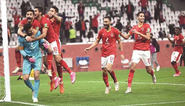 Al Ahly players celebrate with goalkeeper and captain Mohamed El Shenawy (in blue) after their win in the FIFA Club World Cup third-place playoff against Palmeiras at Education City Stadium yesterday. PICTURE: Shemeer Rasheed