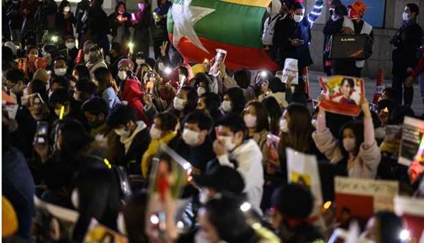 Activists take part in a protest against the military coup in Myanmar outside United Nations University in Tokyo