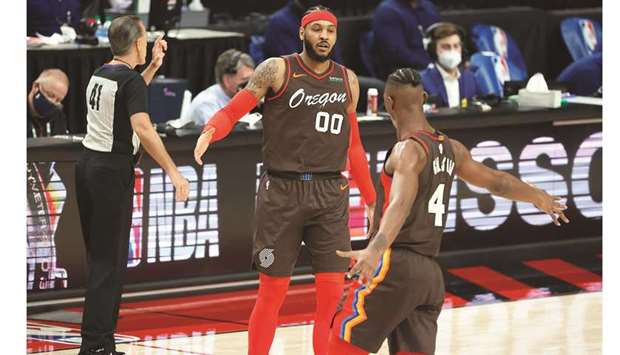 Portland Trail Blazersu2019 Carmelo Anthony (left) celebrates with teammate Harry Giles III after a score against the Philadelphia 76ers during the NBA game at Moda Centre in Portland, Oregon, United States, on Thursday. (USA TODAY Sports)