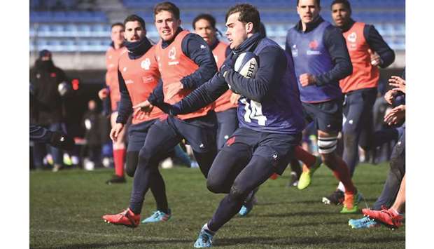 Franceu2019s winger Damian Penaud runs with a ball during a training session in Marcoussis, south of Paris, yesterday.