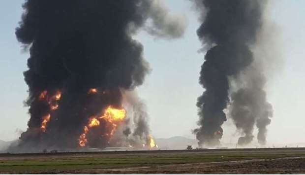 Fire and smoke rise from an explosion of a gas tanker in Herat, Afghanistan in this picture obtained by Reuters from a video