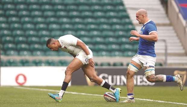 Englandu2019s Anthony Watson scores their fourth try against Italy during the Six Nations Championship match at the Twickenham Stadium in London yesterday. (Reuters)