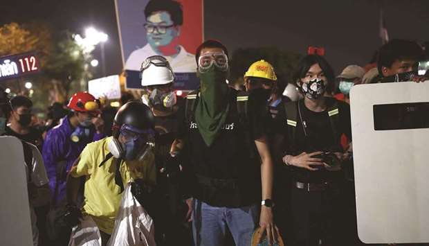 Pro-democracy protesters wearing protective gear during an anti-government rally in Bangkok yesterday.