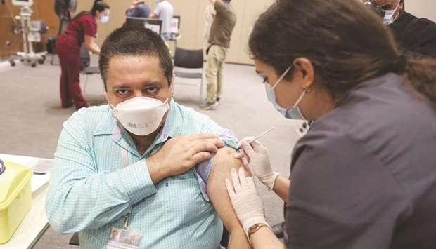 A medic administers a dose of the Covid-19 Pfizer/BioNTech vaccine at Lebanonu2019s American University Medical Center in the capital Beirut, yesterday, as the country kickstarts its inoculation campaign.