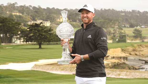 Daniel Berger of the United States celebrates with the trophy after winning the AT&T Pebble Beach Pro-Am at Pebble Beach Golf Links in Pebble Beach, California. (Getty Images/AFP)