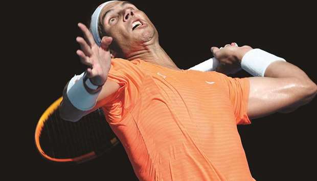 Spainu2019s #Rafael Nadal serves against Italyu2019s Fabio Fognini (not pictured) during their fourth round menu2019s singles match on day eight of the Australian Open in Melbourne yesterday. (AFP)