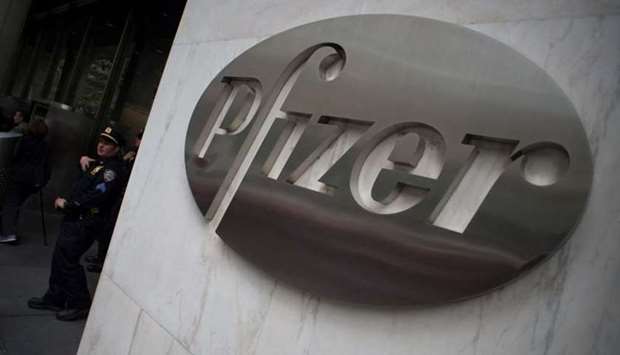 The Pfizer company logo on the wall in front of Pfizeru2019s headquarters in New York