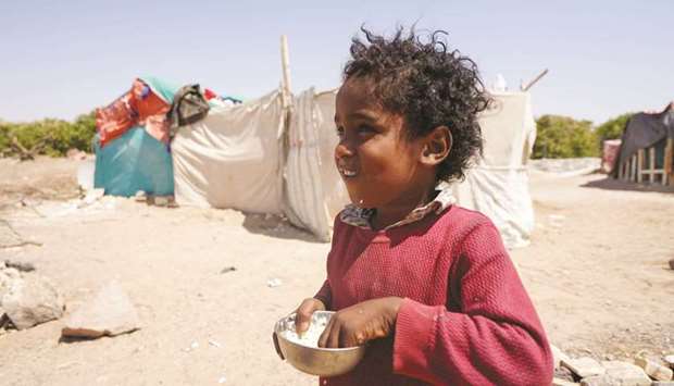 A girl is pictured at a camp for internally displaced people in Marib, Yemen yesterday.