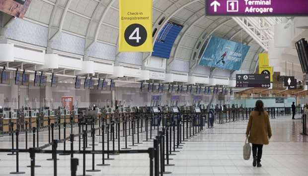A person passes in front of empty check in counters at Toronto Pearson International Airport in Canada. Dozens of airlines have disappeared or filed for bankruptcy since the Covid-19 pandemic outbreak last year, which tore through in a tumultuous, unprecedented way -- leaving carriers in a deep hole, along with a constellation of aerospace manufacturers, airports and leasing firms.