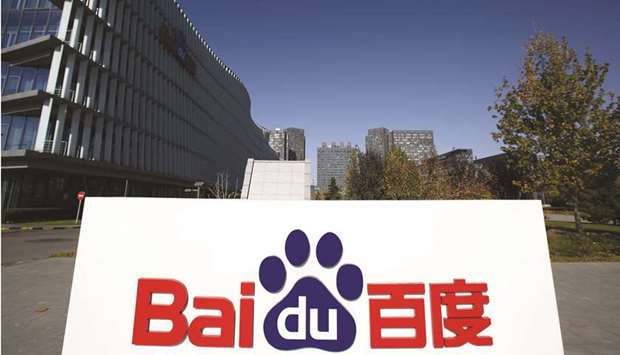 The Baidu logo is displayed outside its headquarters in Beijing. Shares of Chinau2019s largest search engine firm have surged nearly threefold since their mid-March lows, when the worst of the Covid-19 pandemic forced marketers and brands to tighten their budgets. Since then, advertising has staged a recovery, while Baiduu2019s years of investments in artificial intelligence is starting to bear fruit as it monetises the technology in electric vehicles and smart speakers.