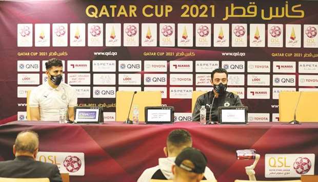 Al Sadd coach Xavi Hernandez (right) and striker Baghdad Bounedjah at a press conference yesterday.