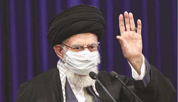 A handout picture provided by the office of Iranu2019s Supreme Leader Ayatollah Ali Khamenei yesterday shows him waving as he addresses people from the East Azerbaijan province by video conference.