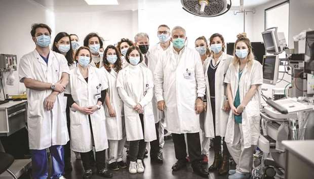 Head of the Department of Obstetrics and Gynaecology and Reproductive Medicine at the Foch Hospital Jean-Marc Ayoubi poses with his team in Suresnes, west of Paris, yesterday. (AFP)