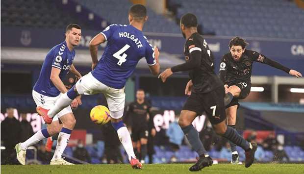 Manchester Cityu2019s Bernardo Silva (right) scores against Everton during the Premier League match at Goodison Park in Liverpool, north west England. (AFP)