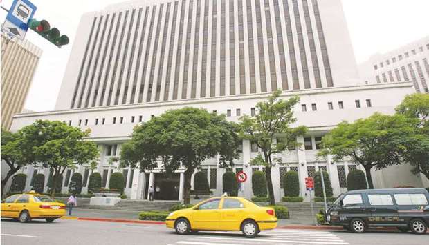 Vehicles stream past the headquarters of Taiwanu2019s central bank in Taipei. Taiwanu2019s benchmark 10-year bond yield fell to a record 0.24% in November and is currently sitting at about 0.37%. The central bank prevents yields on long-term debt from going negative by issuing certificates of deposit to commercial banks in order to absorb excess liquidity in the system.